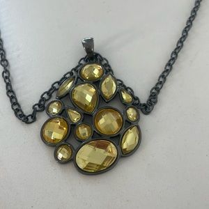 Long yellow gem, black chain necklace